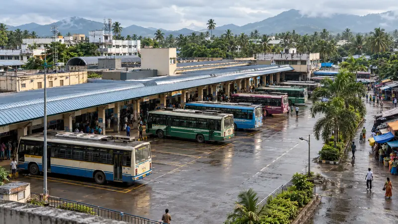 Elevated view of an organised bus-terminal precinct in Vadasery with coconut palms and the Western Ghats beyond
